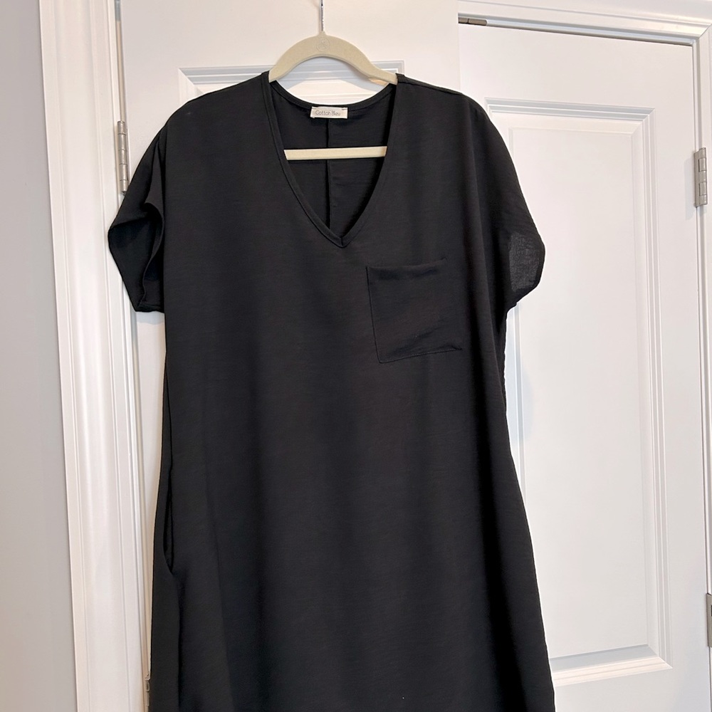 New without tags black shift dress by Cotton Bleu. Fits more like a medium.